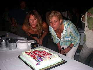 [Jamie Reynolds Conerty and Wendy Meninno blowing candles picture]